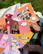 Collection of colorful greeting cards with illustrations on a grassy background